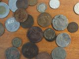a lot of coins that are on the table