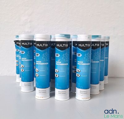 six tubes of multi - use toothpaste are lined up on a table