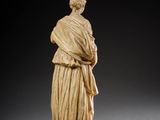 a statue of a woman with a shaw around her neck