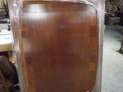 a picture of a piece of furniture that is being wrapped in plastic