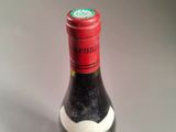 a bottle of wine that is sitting on a table