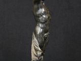 bronze statue of a man holding a ball in his hand