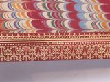 a tray with a colorful design on it sitting on a table