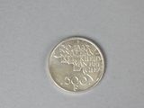 a small coin that is sitting on a table