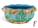 an image of a ceramic planter with a bird on it