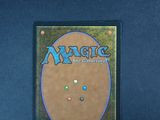 a close up of a magic the gathering card on a table