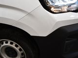 a close up of a white van parked on the side of the road