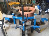 a plant that is sitting on a cart in the garage