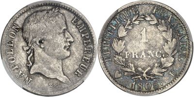 a silver coin with a woman ' s face on it