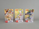 Trois figurines Nintendo Wii sont présentées sur une surface blanche