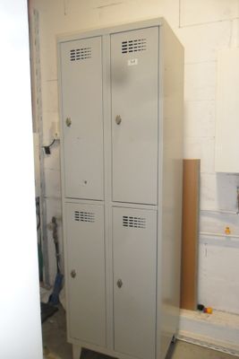two lockers in the corner of a room that is being remodeled