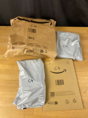 two bags of food sitting on a table next to a bag of food