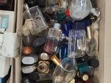 a box full of bottles and other items sitting on the floor