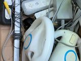 a cardboard box filled with electronic devices and wires