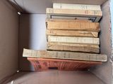 a box full of books sitting on top of a table