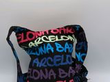 black and multicolored cross body bag with multicolored letters