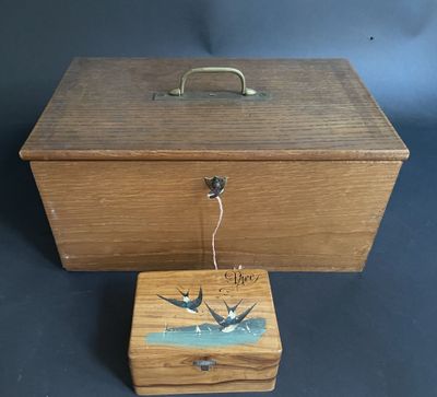 a wooden box with a bird design on it