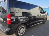 a picture of a black van parked in a parking lot