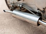 a close up of a motorcycle with a exhaust pipe