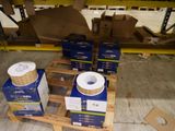 boxes of electrical wire are stacked on a pallet in a warehouse
