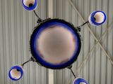 a blue and white chandelier hanging from the ceiling