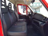 a red truck with black seats in the back of it