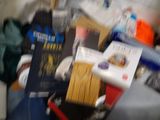 a blurry photo of a pile of books and other items