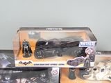 three batman action figures in the box on the table