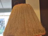 a lamp that is sitting on a table in front of a window