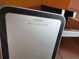 a laptop computer sitting on top of a cardboard box