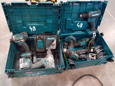 two tools that are in a blue box on the floor