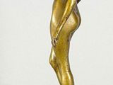 bronze statue of a woman standing on a marble base
