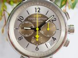 a close up of a wrist watch with a brown dial