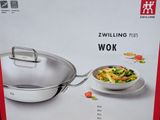a box with a picture of a wok and a bowl of food