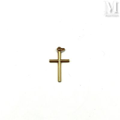 a gold cross on a white surface with a white background