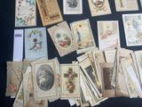 a lot of old postcards on a table