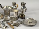 a lot of silver items that are on a table