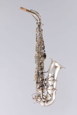 a close up of a saxophone on a white background