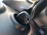 a close up of a car ' s dashboard with a remote control