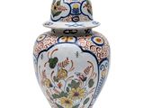 a large vase with a lid on a white background