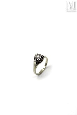 an image of a silver ring with a black diamond on it