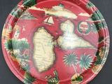 a red plate with a map on it on a table