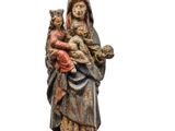 statue of a woman holding a child in her arms
