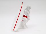 figurine of a man holding a surfboard on a white surface