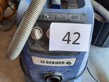 a blue machine that is sitting on the floor
