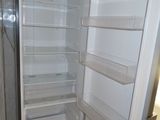 an open refrigerator that is sitting in a kitchen