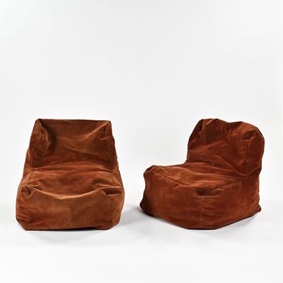a pair of brown bean bags sitting on top of each other
