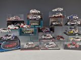 many different models of cars in display cases on a table