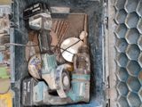a tool box with tools inside of it on the floor