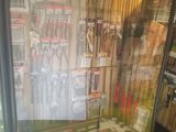a display case with various tools in it in a store